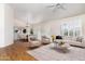 Open-concept living room with modern furnishings, hardwood floors, and lots of natural light at 10316 E Rimrock Loop, Gold Canyon, AZ 85118