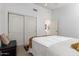 Bright bedroom with lots of space, natural light, walk-in closet and a decorative chair at 10804 W Mohawk Ln, Peoria, AZ 85373