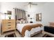 Stylish bedroom with a four-poster bed, decorative elements, and coordinating furniture at 10804 W Mohawk Ln, Peoria, AZ 85373