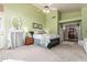 Spacious bedroom with large windows, neutral carpet, and ceiling fan at 10804 W Mohawk Ln, Peoria, AZ 85373