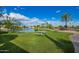Lush community park featuring picnic tables, lake access, palm trees, and expansive grassy areas at 10804 W Mohawk Ln, Peoria, AZ 85373