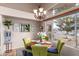 Bright dining area with a table for four, offering views of the canal at 10804 W Mohawk Ln, Peoria, AZ 85373