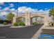 Community entrance sign for The Landings Ventana Lakes with palm trees and well-maintained landscaping at 10804 W Mohawk Ln, Peoria, AZ 85373