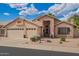 Charming single-story home featuring a three-car garage and desert landscaping at 10804 W Mohawk Ln, Peoria, AZ 85373
