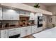 Well-equipped kitchen with modern appliances and a breakfast bar and ample storage at 10804 W Mohawk Ln, Peoria, AZ 85373