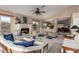 Bright living room featuring a cozy fireplace and open layout, great for entertaining at 10804 W Mohawk Ln, Peoria, AZ 85373