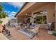 Inviting patio with stylish seating, covered space, and a peaceful outdoor ambiance at 10804 W Mohawk Ln, Peoria, AZ 85373