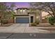 Charming two-story home with a well-maintained front yard and a two-car garage at 15758 W Cortez St, Surprise, AZ 85379