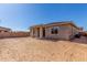 Spacious, unfinished backyard showcasing potential for creating your ideal outdoor living space at 21829 E Bonanza Ct, Queen Creek, AZ 85142