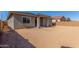 Unfinished backyard featuring a covered patio awaiting your personal touch for outdoor enjoyment at 21829 E Bonanza Ct, Queen Creek, AZ 85142