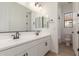 Bright bathroom featuring double sinks, modern fixtures, and convenient toilet access at 21829 E Bonanza Ct, Queen Creek, AZ 85142