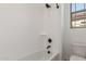 Bathroom featuring a shower/tub combination with white tiling and black shower head at 21829 E Bonanza Ct, Queen Creek, AZ 85142