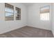 Comfortable bedroom featuring two windows that provide abundant natural light and views at 21829 E Bonanza Ct, Queen Creek, AZ 85142