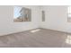 Serene bedroom with plush carpeting, neutral tones, and large windows creating a relaxing atmosphere at 21829 E Bonanza Ct, Queen Creek, AZ 85142
