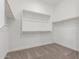 Walk in closet featuring carpeted floors and a clothing rack to organize your attire at 21829 E Bonanza Ct, Queen Creek, AZ 85142