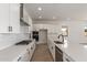 Well-appointed kitchen with white cabinets, a gas cooktop, stainless appliances, and sleek countertops at 21829 E Bonanza Ct, Queen Creek, AZ 85142