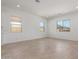 Bright living room with neutral walls, tile floors, and multiple windows offering ample natural light at 21829 E Bonanza Ct, Queen Creek, AZ 85142