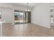 Bright living area with sliding glass doors and modern lighting, offering a seamless indoor-outdoor transition at 21829 E Bonanza Ct, Queen Creek, AZ 85142