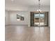 Bright and airy living room featuring tile floors and sliding glass doors to the outdoors at 21829 E Bonanza Ct, Queen Creek, AZ 85142