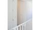 Upstairs hallway with white walls and a white railing at 2442 W Rowel Rd, Phoenix, AZ 85085