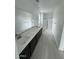 Sleek bathroom with double vanity, modern fixtures, and glass-enclosed shower at 2470 W Rowel Rd, Phoenix, AZ 85085