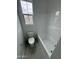 Clean bathroom featuring a toilet, a bathtub-shower combo, and a large window at 2470 W Rowel Rd, Phoenix, AZ 85085