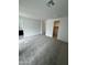 Spacious bedroom features neutral walls, plush carpeting, and a walk-in closet at 2470 W Rowel Rd, Phoenix, AZ 85085
