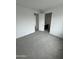 Spacious bedroom with neutral carpeting and access to ensuite bathroom at 2470 W Rowel Rd, Phoenix, AZ 85085