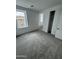 Bedroom with plush carpeting, window views and a closet for ample storage at 2470 W Rowel Rd, Phoenix, AZ 85085