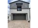 Two-story home with a two-car garage and a balcony on the second floor at 2470 W Rowel Rd, Phoenix, AZ 85085
