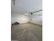 Spacious garage with painted walls, concrete floors and garage door opener at 2470 W Rowel Rd, Phoenix, AZ 85085