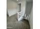 Upstairs hallway showing carpeted staircase with white banister at 2470 W Rowel Rd, Phoenix, AZ 85085