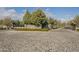 Gated entrance to Calliandra Estates with stone-paved entry and lush landscaping at 2563 E Muirfield St, Gilbert, AZ 85298