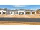 New construction home exterior showcases an open garage, front windows and a smooth black asphalt street at 26536 S 188Th Pl, Queen Creek, AZ 85142