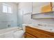 Classic bathroom with a blue-tiled shower, a sink, and a vanity at 5455 E Baltimore St, Mesa, AZ 85205