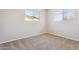 Bright bedroom with ample natural light from two windows at 5455 E Baltimore St, Mesa, AZ 85205