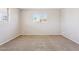 Bedroom with carpet flooring and a window with outside views at 5455 E Baltimore St, Mesa, AZ 85205