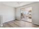 Bright, airy bedroom with a large window, hardwood flooring and patio access at 5455 E Baltimore St, Mesa, AZ 85205