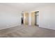 This bedroom features neutral tones, carpet flooring, and closet at 5455 E Baltimore St, Mesa, AZ 85205
