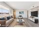 Bright living room with hardwood floors and a comfortable sofa with stylish blue pillows at 5455 E Baltimore St, Mesa, AZ 85205