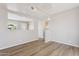 Clean living room with hardwood floors, bright open space, and a minimalist aesthetic at 5455 E Baltimore St, Mesa, AZ 85205