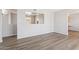 Open concept living room with hardwood floors and neutral paint at 5455 E Baltimore St, Mesa, AZ 85205