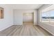 Open-concept living room with hardwood floors and ample natural light at 5455 E Baltimore St, Mesa, AZ 85205