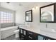 Modern bathroom featuring dual sinks, stylish fixtures, and a standalone tub at 1165 E Avenida Kino --, Casa Grande, AZ 85122