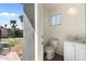 This half bathroom has a view of the backyard with sink and vanity at 1165 E Avenida Kino --, Casa Grande, AZ 85122