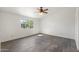 Sunlit bedroom showcases stylish wood flooring and a ceiling fan at 1165 E Avenida Kino --, Casa Grande, AZ 85122