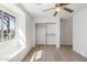 This bright bedroom features a large window, a closet, and beautiful wood flooring at 1165 E Avenida Kino --, Casa Grande, AZ 85122