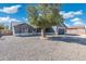 Charming single-story home with a two-car garage and a low-maintenance desert landscape in the front yard at 1165 E Avenida Kino --, Casa Grande, AZ 85122