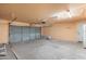 Clean two-car garage featuring an automatic door opener, plus room for storage at 1165 E Avenida Kino --, Casa Grande, AZ 85122