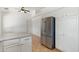 Open kitchen space boasts stainless steel refrigerator and ample white cabinet storage at 1165 E Avenida Kino --, Casa Grande, AZ 85122